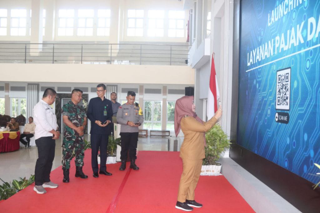 LAUNCHING : Pemerintah Kabupaten (Pemkab) Pulang Pisau (Pulpis) resmi melaunching sistem informasi pajak daerah ” V-TAX” dan layanan jejak daerah (jempu pajak daerah) yang digelar di aula Banama Tingang, Selasa (3/9/2024). (foto:juandi)